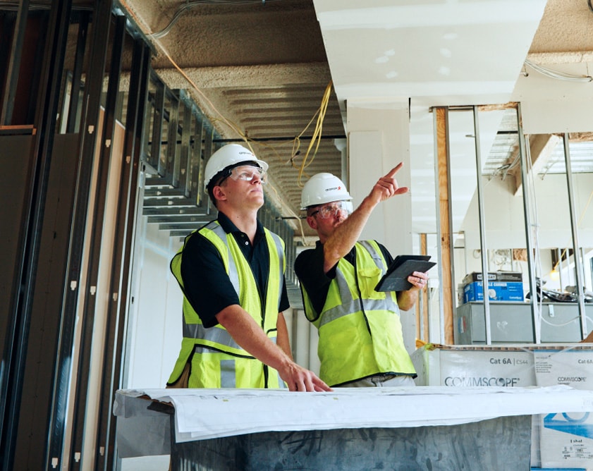 Two workers in construction site