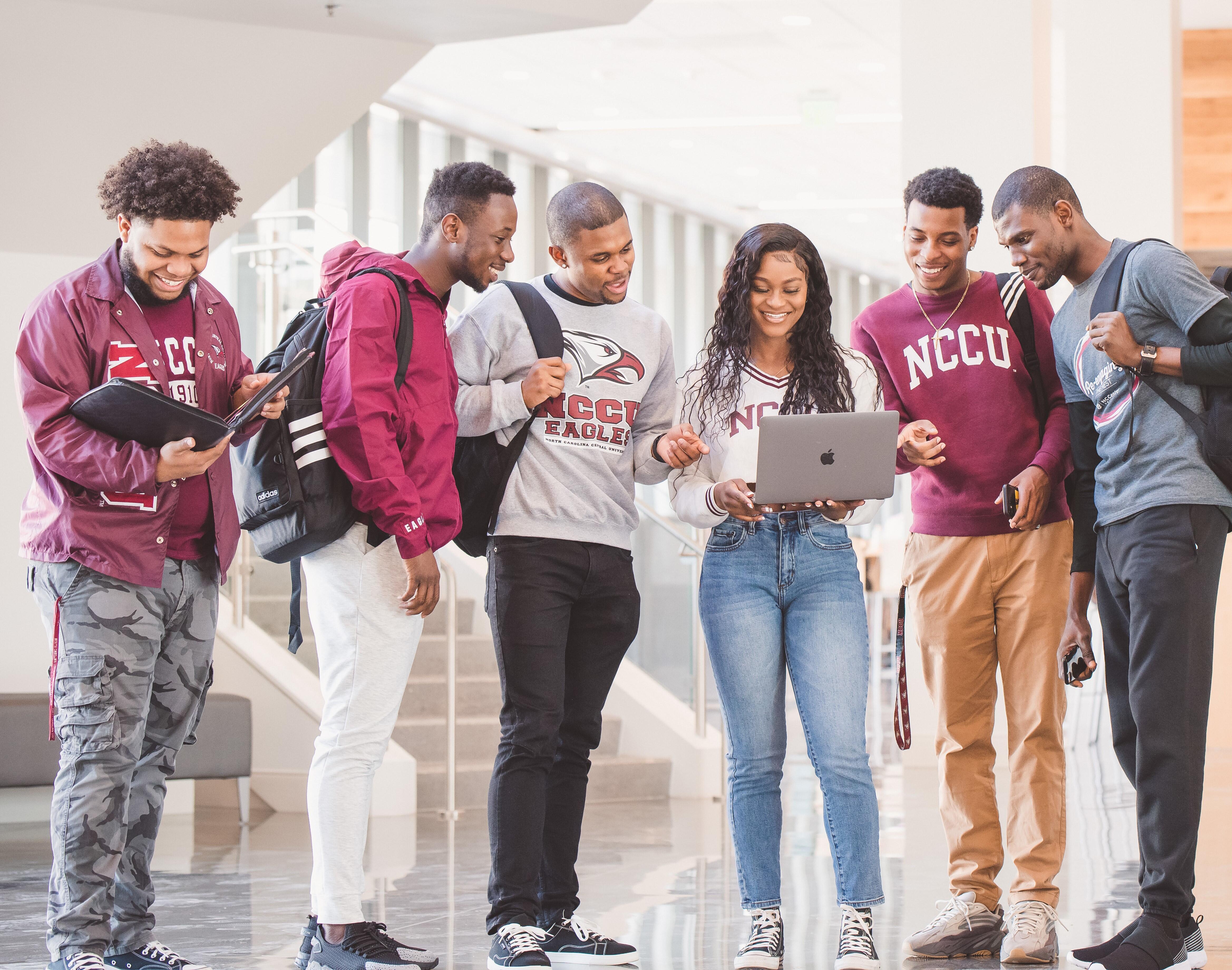 Students Standing in a hallway.